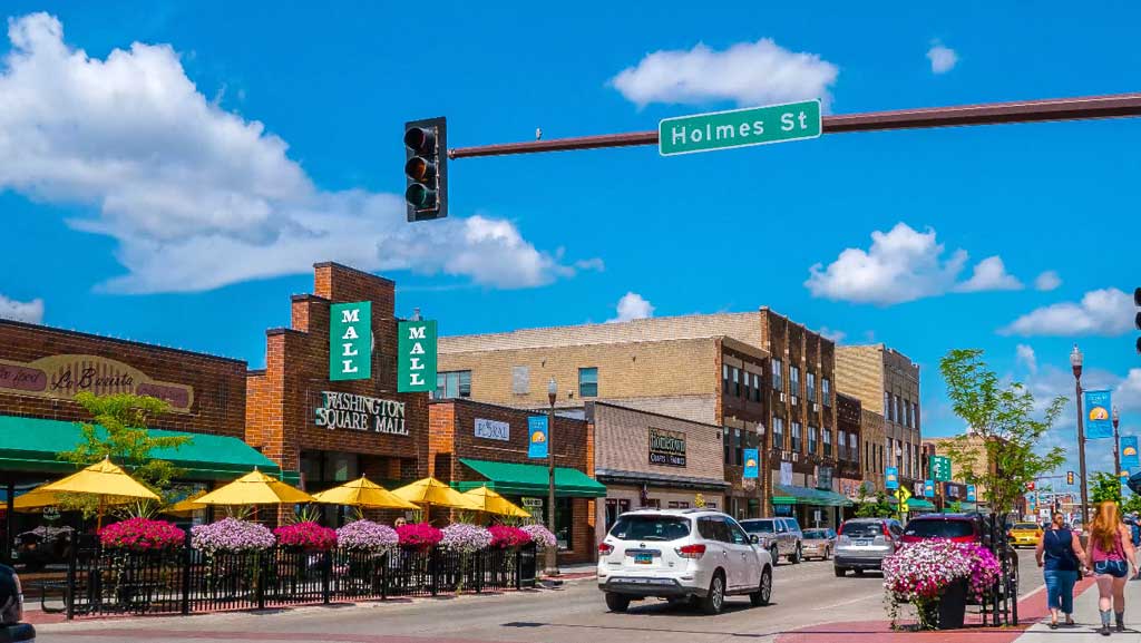Downtown Detroit Lakes on a sunny day, umbrellas and shops on Washington Avenue
