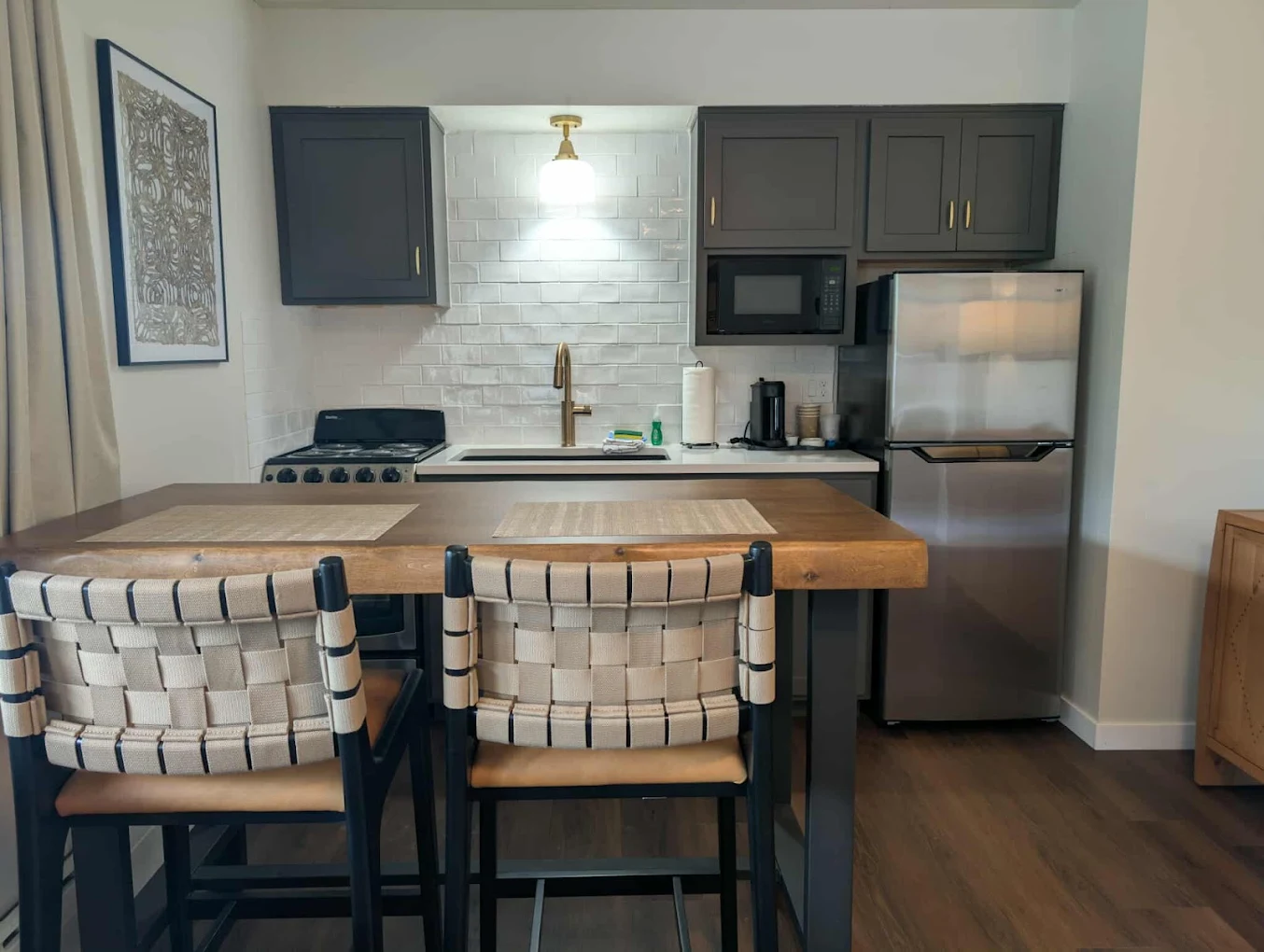 Kitchenette with subway tile and island